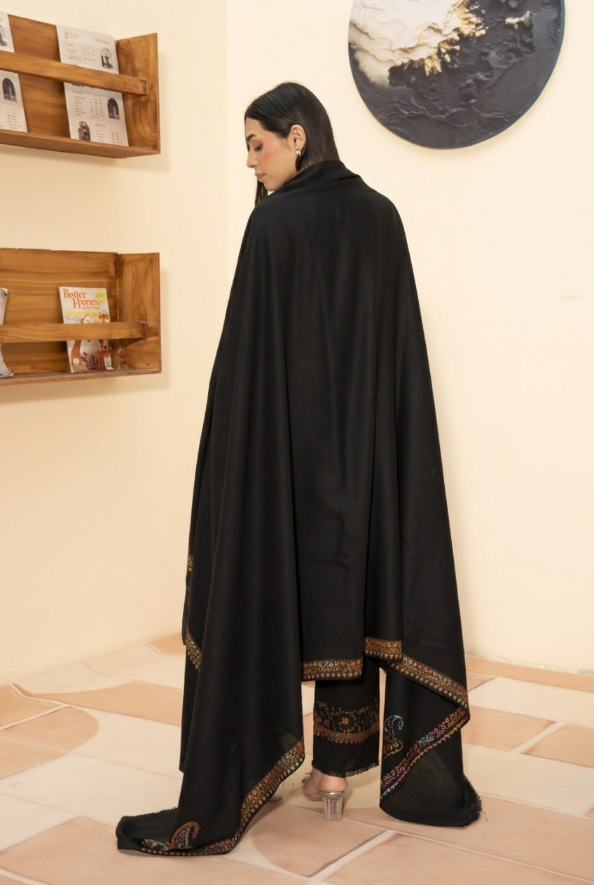 Kingri embroidered pashmina wool shawl in black styled with black hand embroidered pashmina coord set, back view